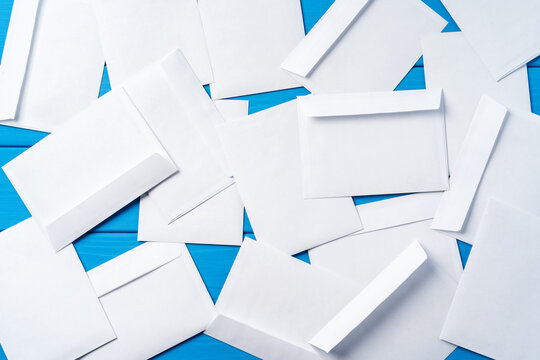 Stack Of Envelopes On Working Desk Top View. Business Mail