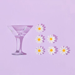 Spring creative pattern with martini glass and white flowers  on pastel purple background. 80s or...