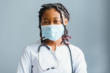 Portrait Of Smiling Female Doctor Wearing White Coat With Stethoscope In Hospital Office
