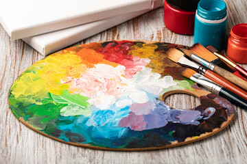 art palette with colorful mixed paints