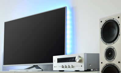Fototapeta na wymiar Large LED TV with backlight and audio receiver in a modern apartment. 