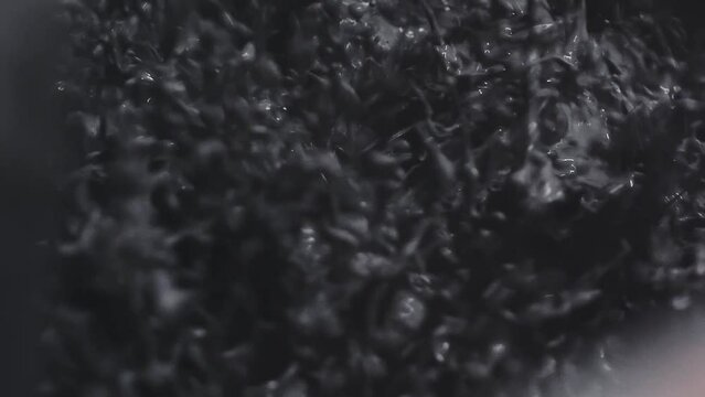 Oil rig shale shaker separating cuttings from drilling mud in slow motion