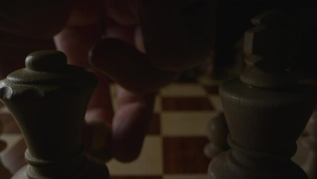 Player moves Queen&rsquo;s pawn two spaces forward to D4 in a chess game. Low angle static shot.