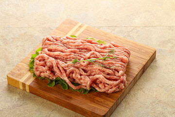 Raw minced pork meat over board