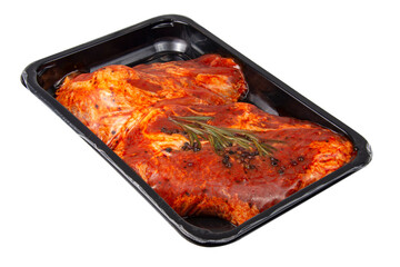 Premium meat steak with rosmary and spices in vacuum box isolated on the white background