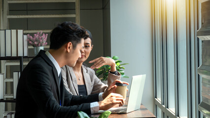 Professional businessman giving some new ideas about project to his partners in conference room.