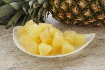 Marinated pineapple slices in the bowl