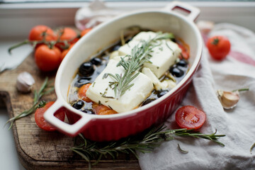 Baked feta with tomatoes, olives, garlic