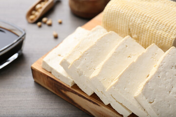 Natural tofu on wooden table, closeup. Soy product