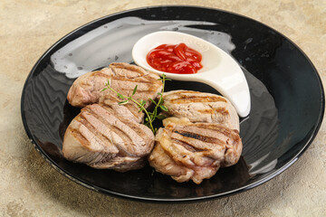 Grilled pork tenderlion with tomato sauce