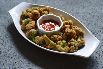 a plate of fried crispy broccoli 