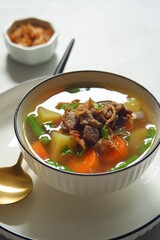 a bowl of beef and vegetables soup 
