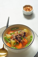 a bowl of beef and vegetables soup 