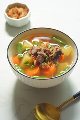 a bowl of beef and vegetables soup 