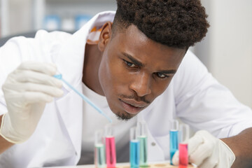 scientist in laboratory filling liquid in appliance