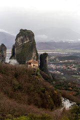 Fototapeta na wymiar Orthodox monasteries of Meteora (Greece) on the rocks shrouded in fog