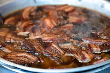 A lot of Taiwanese stew pork belly boiling in giant pot