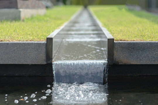 Water Running In Rainspout In The Garden