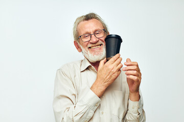 old man in a shirt and glasses a black glass light background