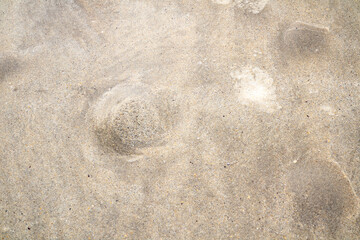 Bubbles in the sand showing that the tide is coming in