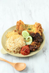 Nasi Campur Buk Madura with Paru (Cow Lung) and Serundeng (Shredded Coconut).