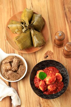 Ketupat, Rendang, And Telur Balado, TOp View On Wooden Table