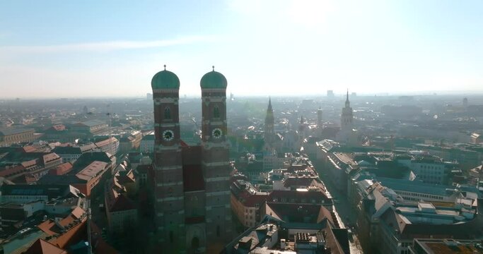 Beautiful Munich panoramic architecture in Bavaria, Germany at sunrise. Aerial view of the Frauenkirche and town hall on Marienplatz.