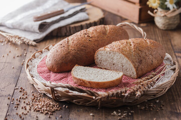 bread and wheat on wooden table