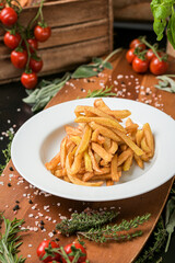 A dish with french fries ready to be served. One of the most popular snack side food in the world. Food photography.