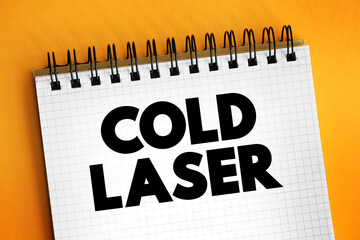 Cold laser - therapy that uses low-level lasers to alter cellular function, text concept on notepad