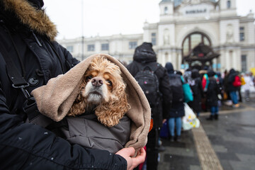 Ukrainian refugees on Lviv railway station waiting for train to escape to Europe