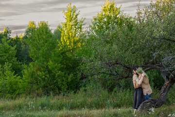 couple hugging near a tree in the park