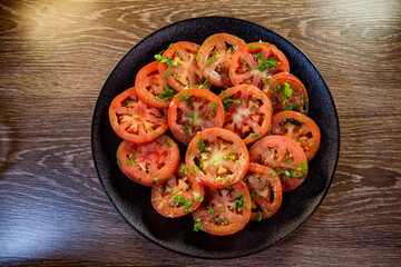 appetizer of fresh tomatoes with spices and olive oil