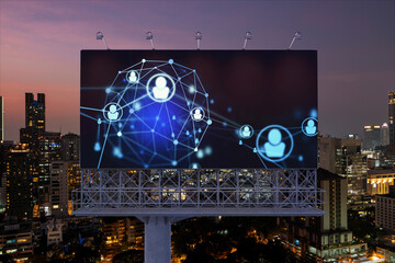 Glowing Social media icons on billboard over night panoramic city view of Bangkok. The concept of networking and establishing new connections between people and businesses in Southeast Asia
