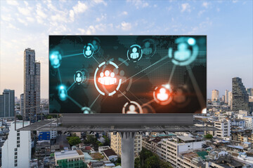 World planet Earth map hologram of social media icons over sunset panoramic cityscape of Bangkok, Southeast Asia. The concept of people connections.