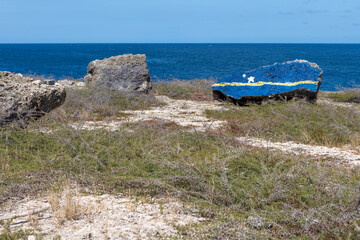 The flag of Curacao painted on a rock near the Watamula Hole on Curacao, island in the Caribbean