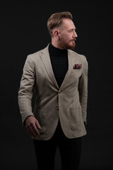 Confident businessman walking forward wearing a causal suit, handsome senior business man hero shot portrait isolated on black