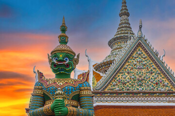 Fototapeta premium Giants front of the church at Wat Arun Temple. Wat Arun is among the best known of Thailand's landmarks. Wat Arun is a Buddhist temple in Bangkok Yai district of Bangkok, Thailand.