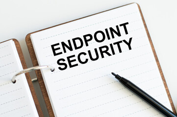 Text ENDPOINT SECURITY on a notebook on a desk, a business concept