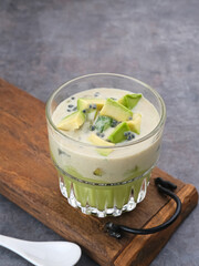 Avocado Milk Cheese Dessert is made from avocado, jelly, cheese, basil seeds, sweetened condensed milk and evaporated milk. Served in a glass. Space for text
