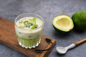 Avocado Milk Cheese Dessert is made from avocado, jelly, cheese, basil seeds, sweetened condensed milk and evaporated milk. Served in a glass. Space for text
