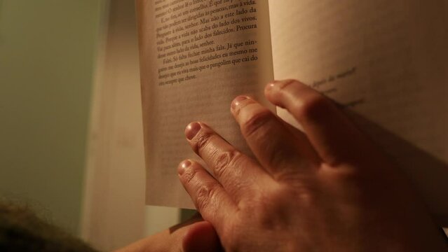 A beautiful middle aged woman reading a good book at home. High quality photo