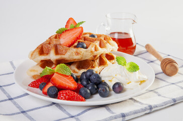   Waffles with berries and fruit. Healthy sweet summer breakfast