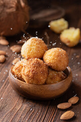 Coconut cookies with almonds in a bowl
