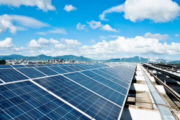 Solar panels against blue sky background