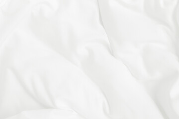 Texture of white blanket and bedding sheet with crumpled or messy in bedroom after wake up.