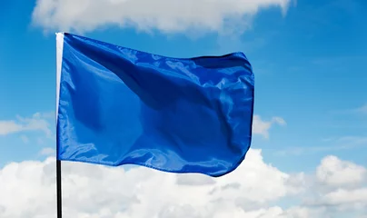 Fotobehang Blue flag waving on sky © xy