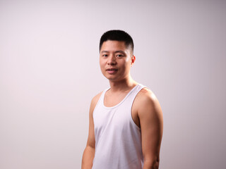 A man in a white vest