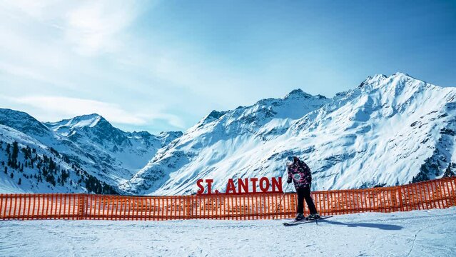 Timelapse of people having a rest in the St. Anton ski resort in Austria. People taking photos and having a drink at the ski resort in mountains.
