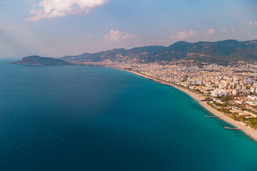 Obraz premium Drone photo of Alanya coast with Mediterranean turquoise sea and mountains, Turkey